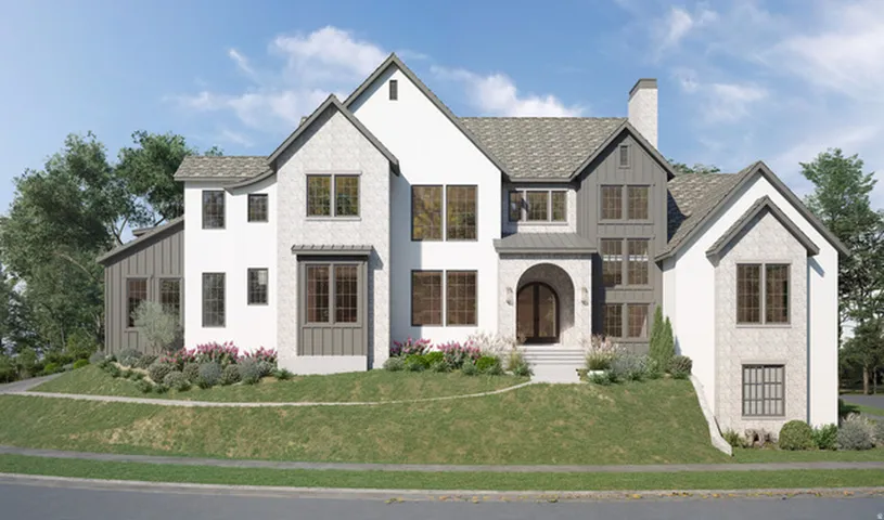 Modern farmhouse exterior with white stucco, gray board and batten siding, gray gabled roofing, a prominent arched entry, and extensive landscaping