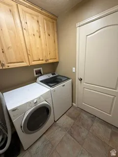Wood-finish cabinetry offers storage with a durable tile floor