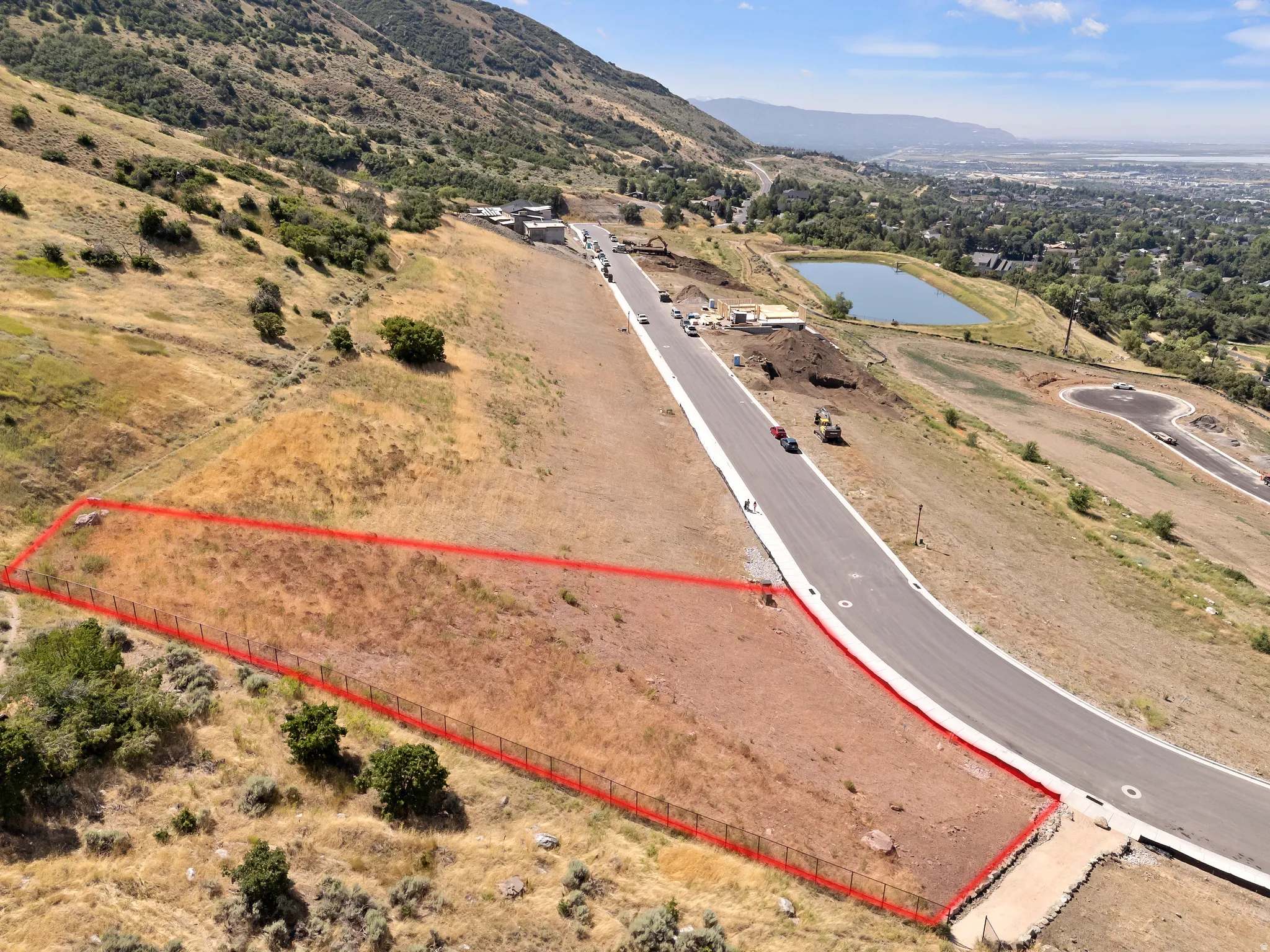 Expansive undeveloped lot with existing perimeter fencing