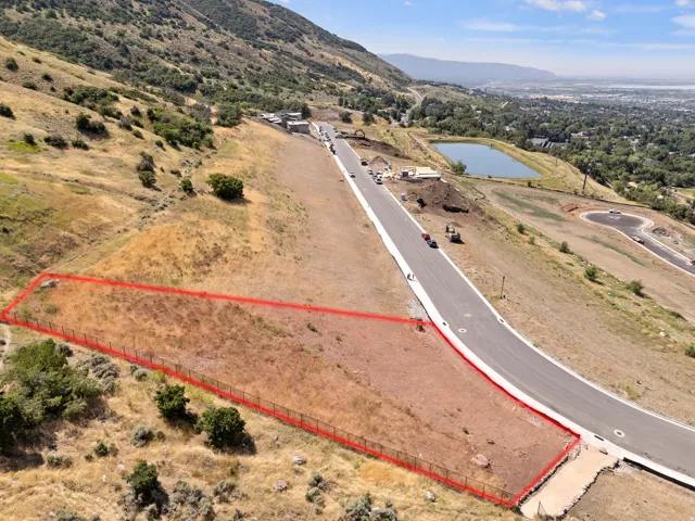 Expansive undeveloped lot with existing perimeter fencing