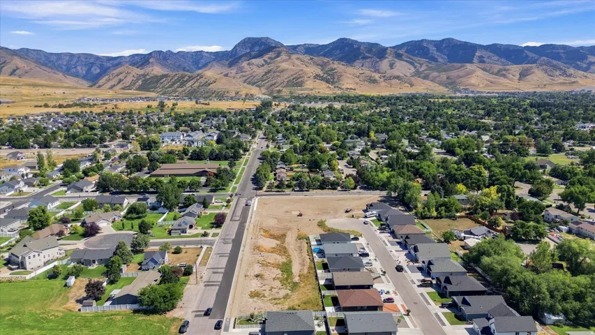 Expansive mountain backdrop with a developed residential area