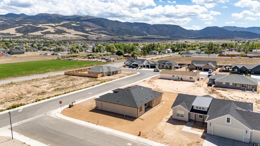 New construction residential development featuring modern residences and mountain scenery