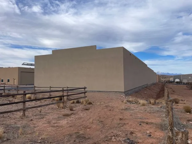 Earth-toned stucco exterior with a flat roofline