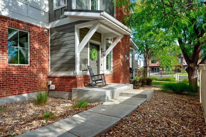 Brick and siding exterior with a covered entry