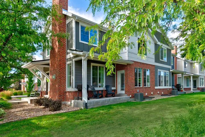 Brick and siding exterior with a prominent brick chimney