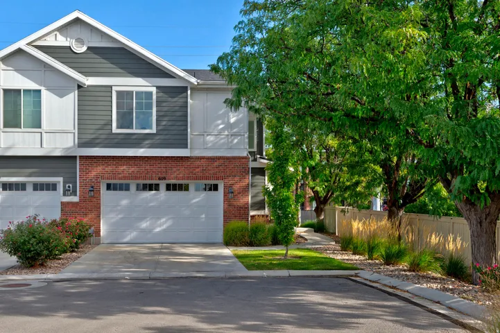 Brick and siding exterior with a two-car garage