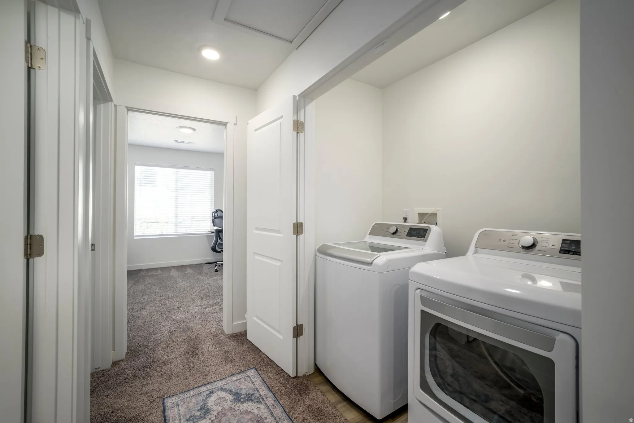 Dedicated laundry area with durable flooring