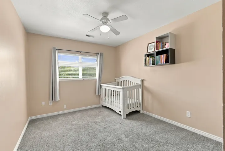 Neutral-toned walls with carpeted flooring