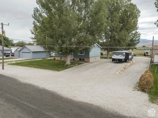 Expansive gravel driveway providing ample parking