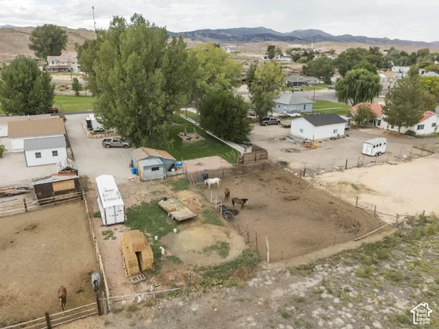 Multiple fenced corrals, open structures, and an auxiliary building