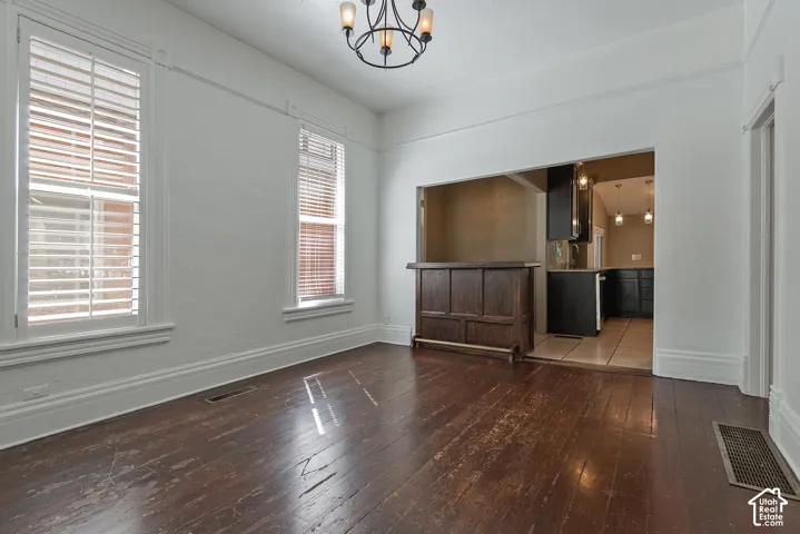 Hardwood flooring throughout, with plantation shutters on multiple windows