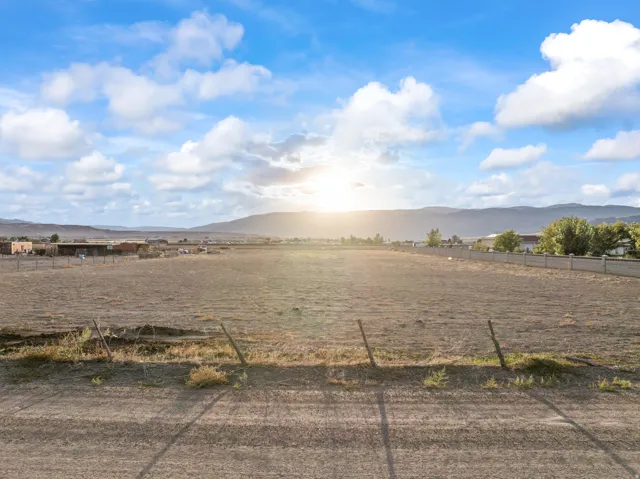 Expansive undeveloped lot with distant mountain backdrop