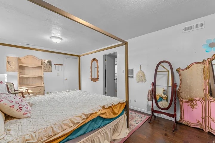 Wood-finish flooring with white walls and trim