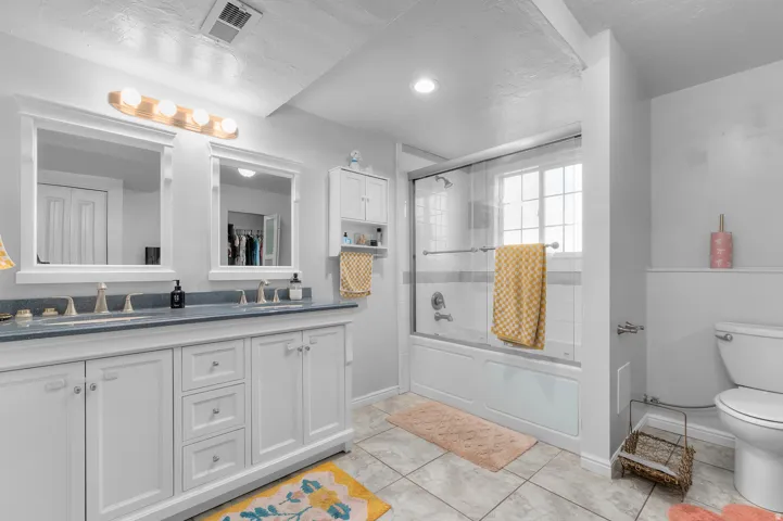 Dual vanity with integrated sinks and individual framed mirrors