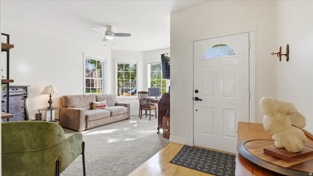 Entry door with an arched decorative glass insert and black hardware
