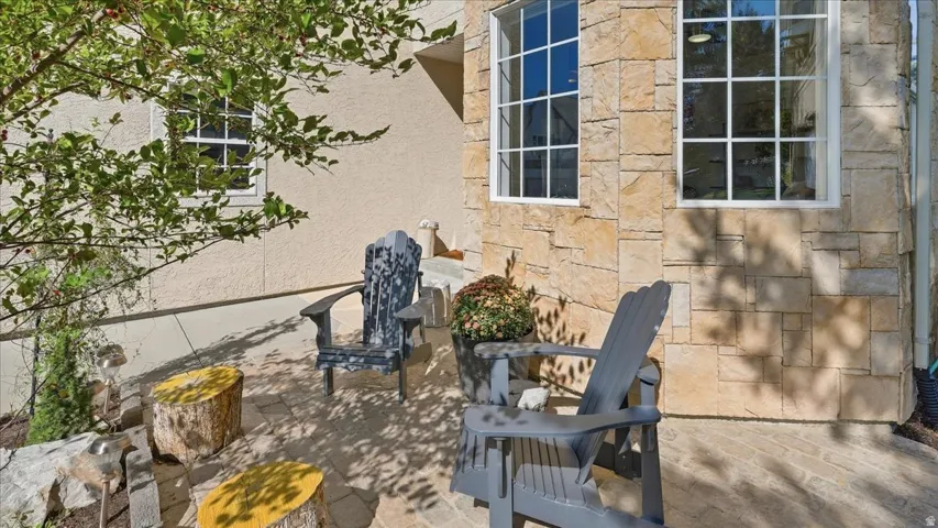 Stone and stucco exterior with multiple windows