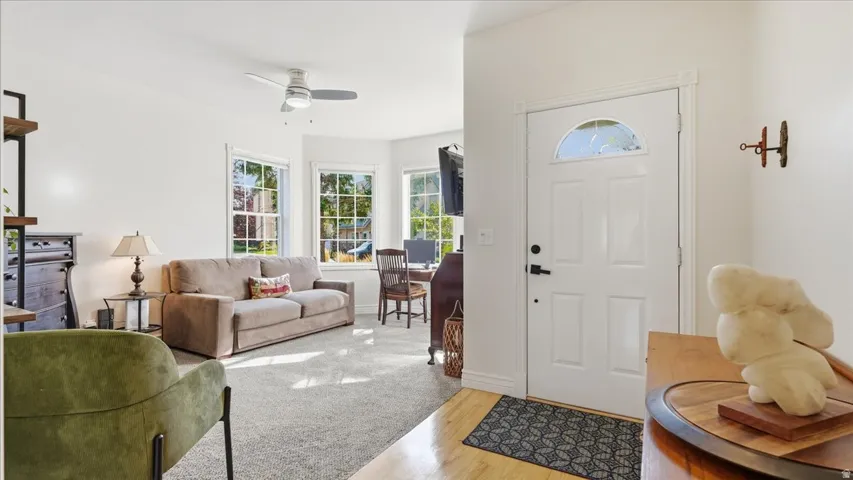 Entry door with an arched decorative glass insert and black hardware