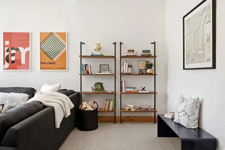 Recessed wall shelving units with wood-finish shelving and metal framing