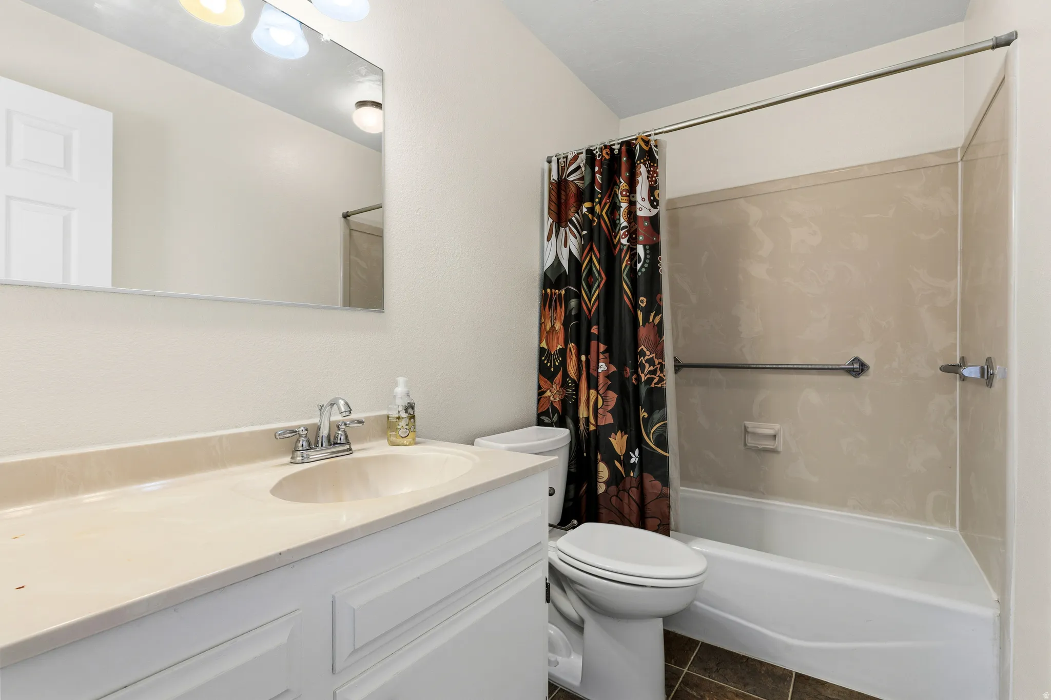 Single vanity with an integrated sink and chrome faucet