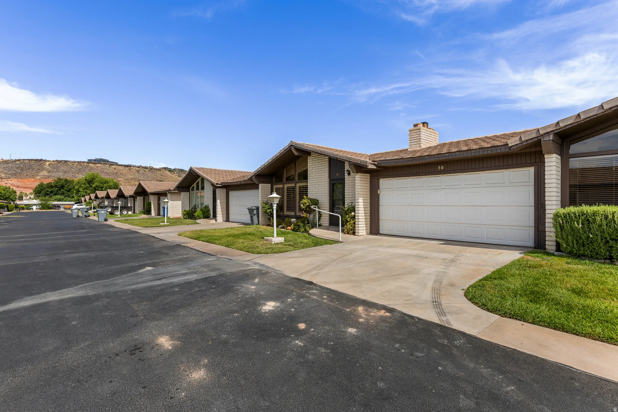 Attached single-car garage with concrete driveway