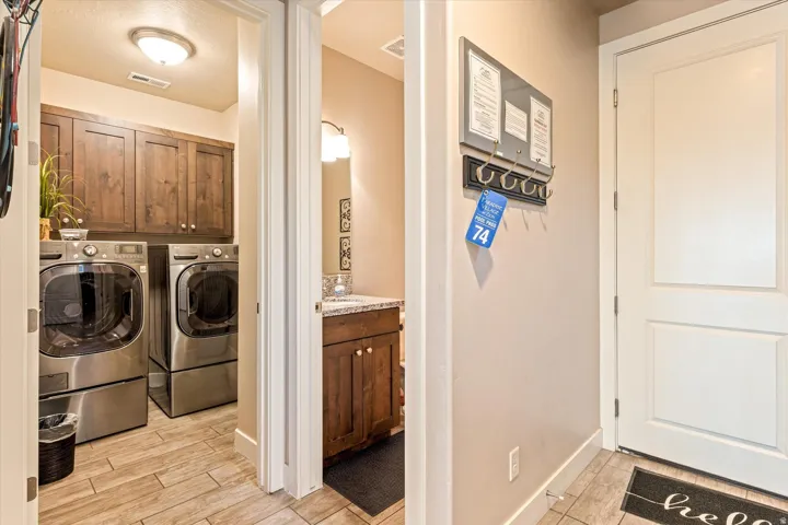 Wood-finish flooring throughout the laundry area and entryway