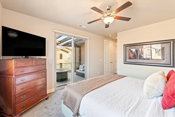Sliding glass door access to a private exterior balcony