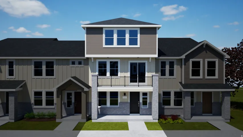 Modern townhome exterior with mixed siding, stone accents, multiple windows, and an upper-level balcony with metal railing