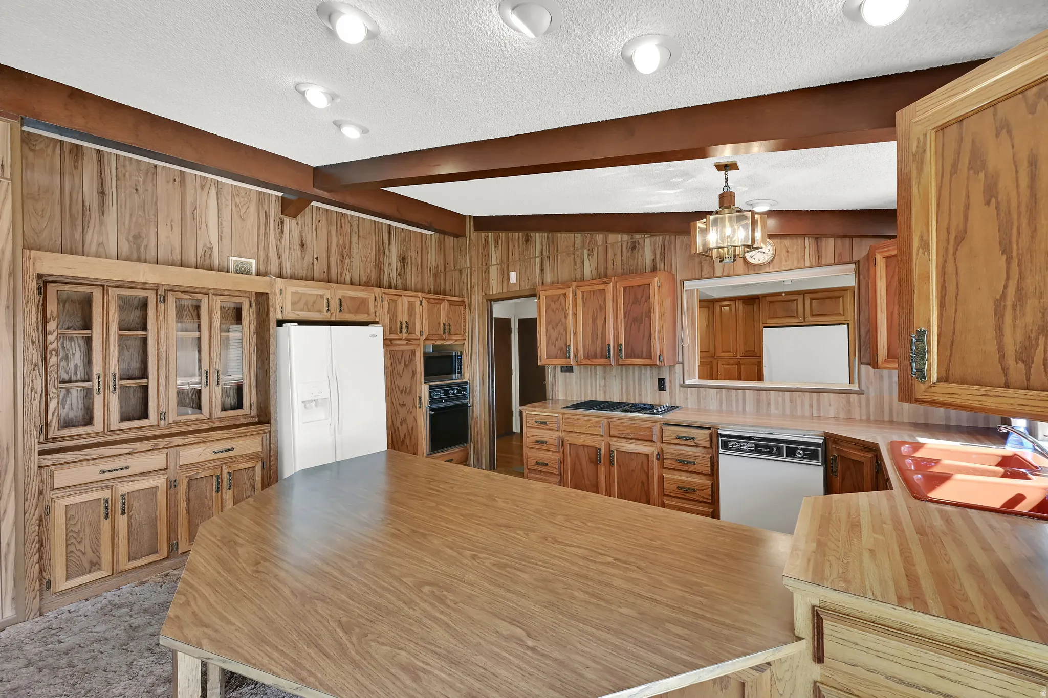 Wood-paneled walls and ceiling beams