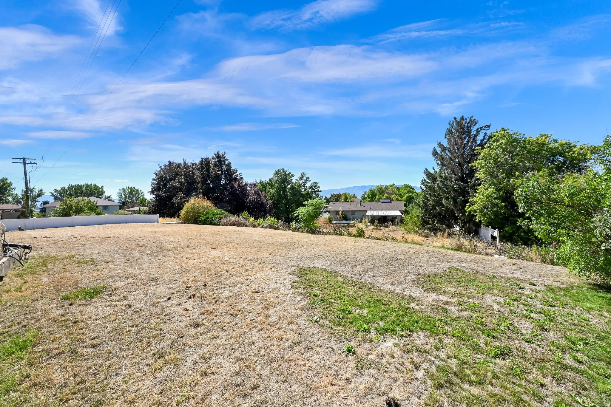 Expansive lot featuring a varied terrain and distant mountain range