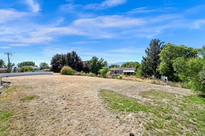 Expansive lot featuring a varied terrain and distant mountain range