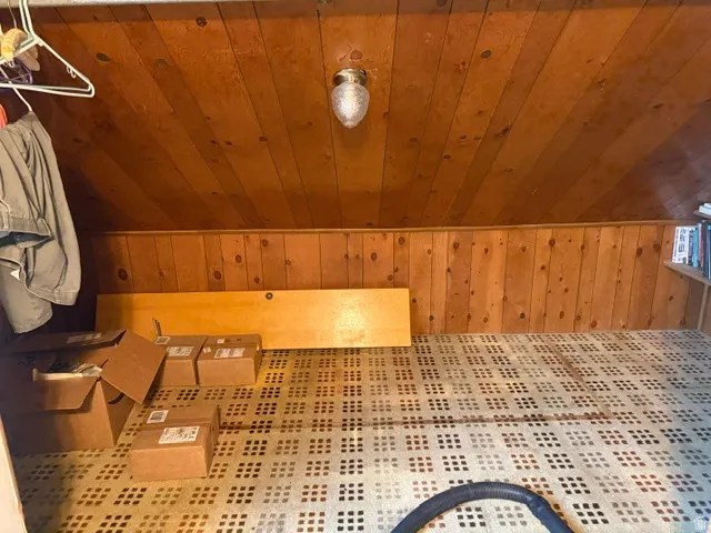 Wood-paneled ceiling and walls with recessed lighting
