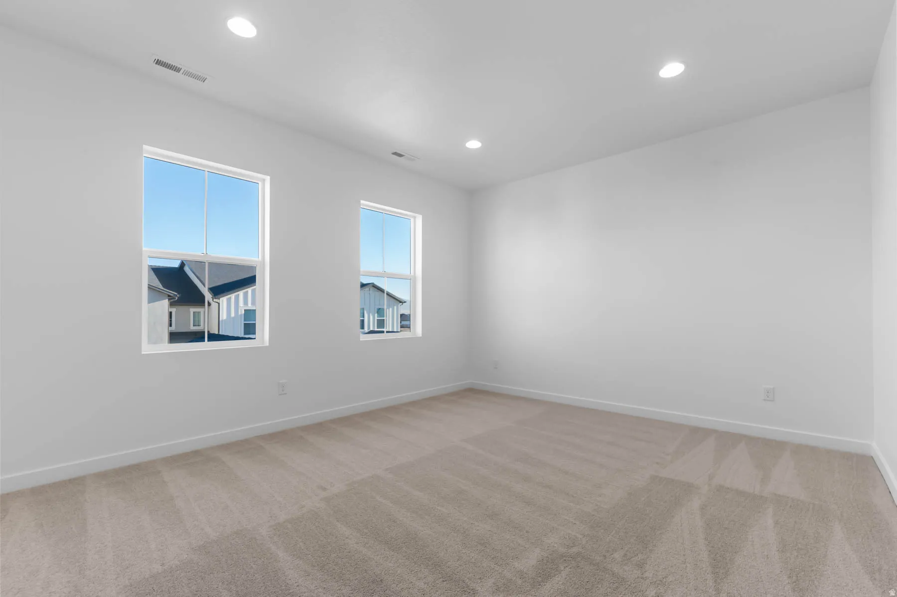 Neutral wall tones with recessed lighting