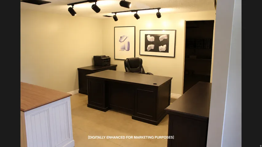 Track lighting fixtures, neutral wall color, and light-toned flooring