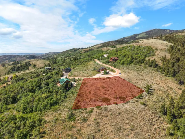 Expansive undeveloped lot with a mountainous backdrop
