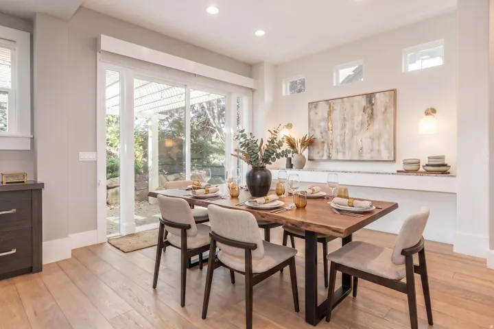 Light wood-finish flooring, recessed lighting, and a built-in wall shelf with sconce lighting