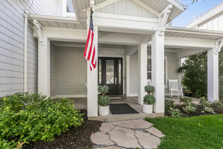 Covered front porch with shaker siding