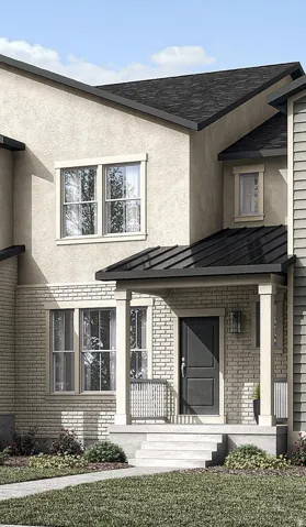 Stucco and brick exterior with a prominent front entry