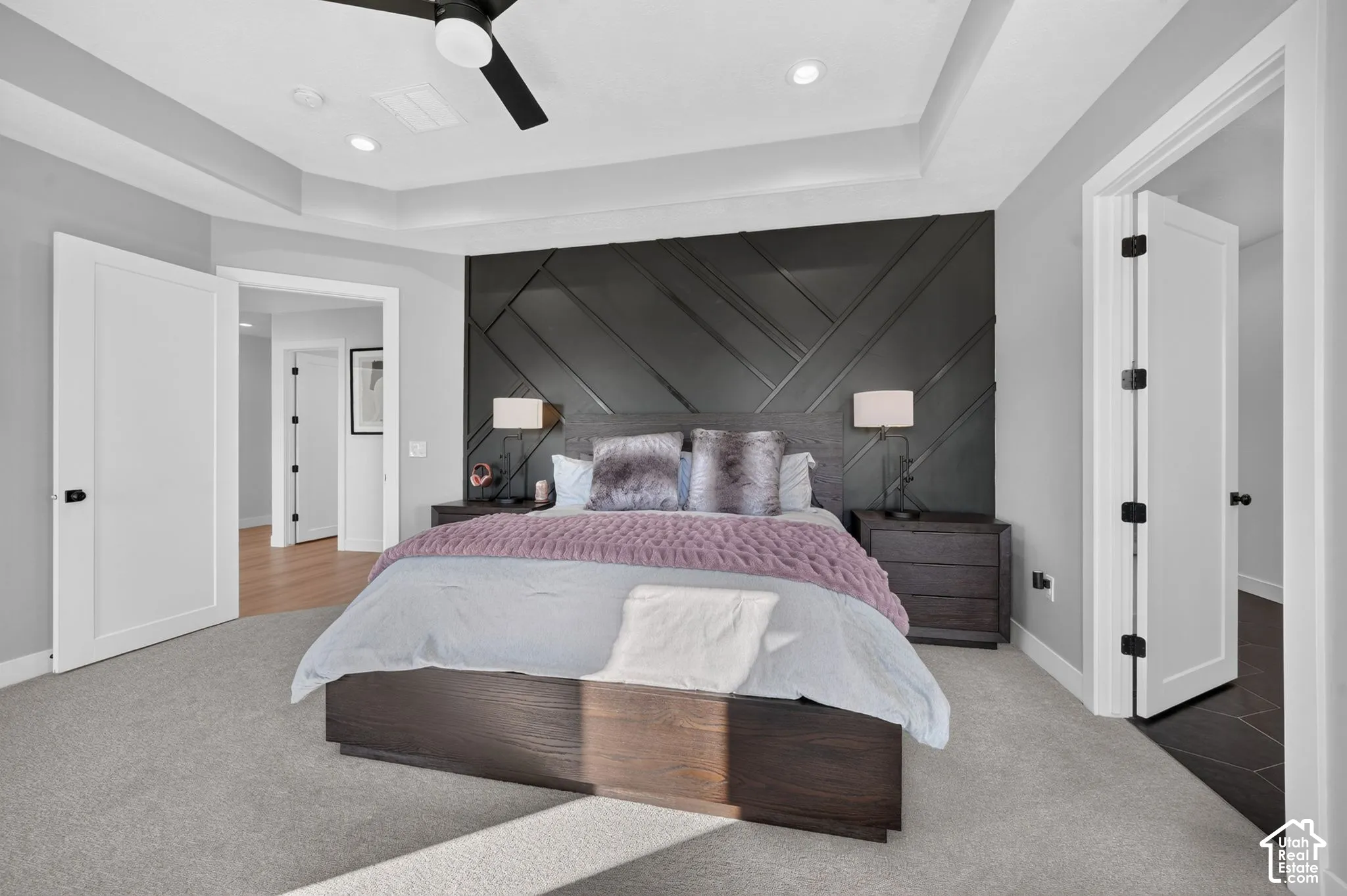 Tray ceiling with recessed lighting and a ceiling fan