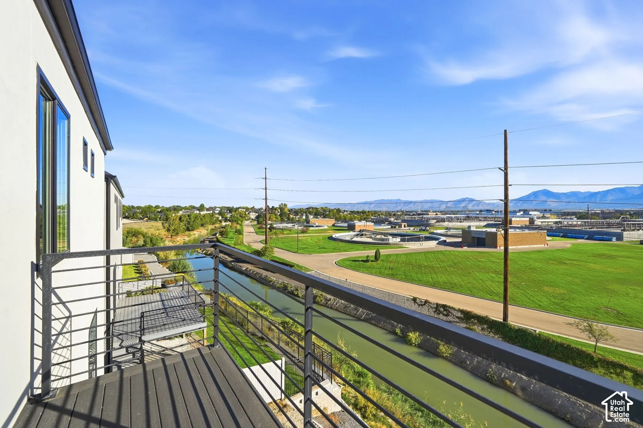 Balcony with composite decking and black metal railings