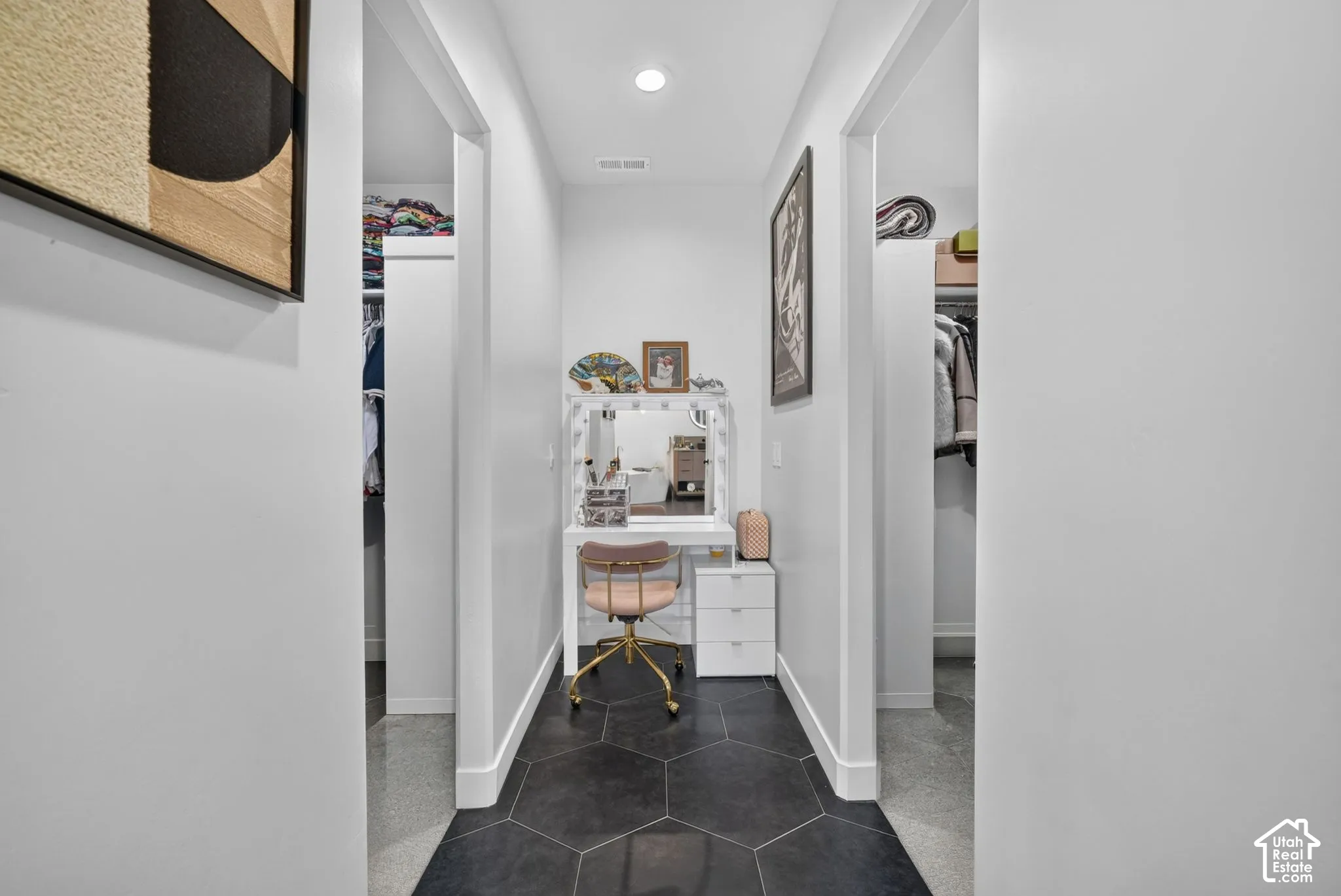 Hexagonal floor tiling, recessed lighting, and white trim