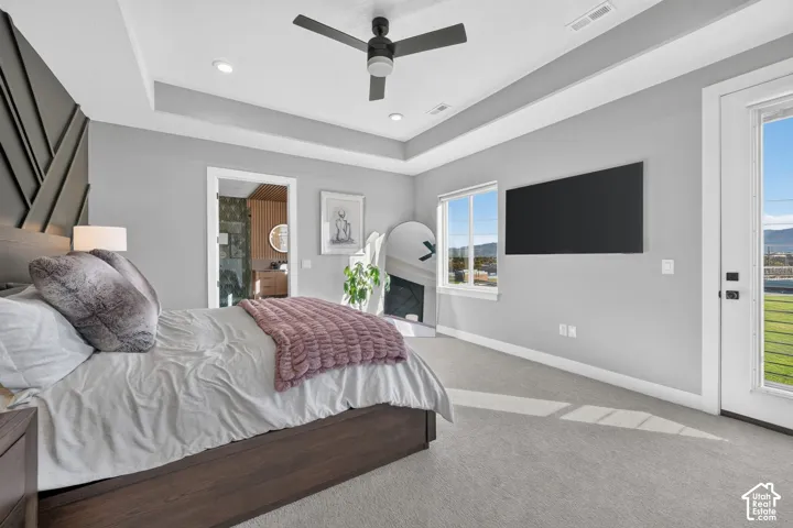 Tray ceiling with recessed lighting and a ceiling fan