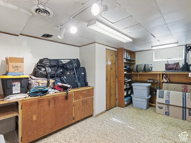 Basement bedroom utilized as workshop/storage