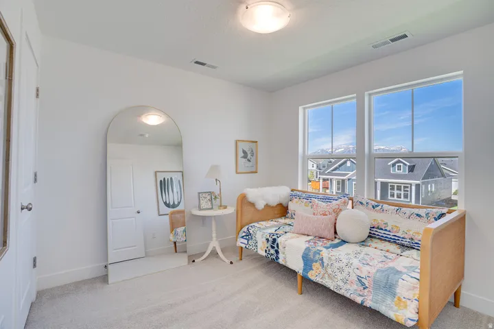 White walls and neutral carpeting provide a bright canvas for personalization
