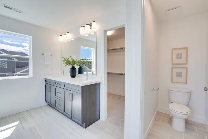 Dual-sink vanity with a light countertop and ample storage
