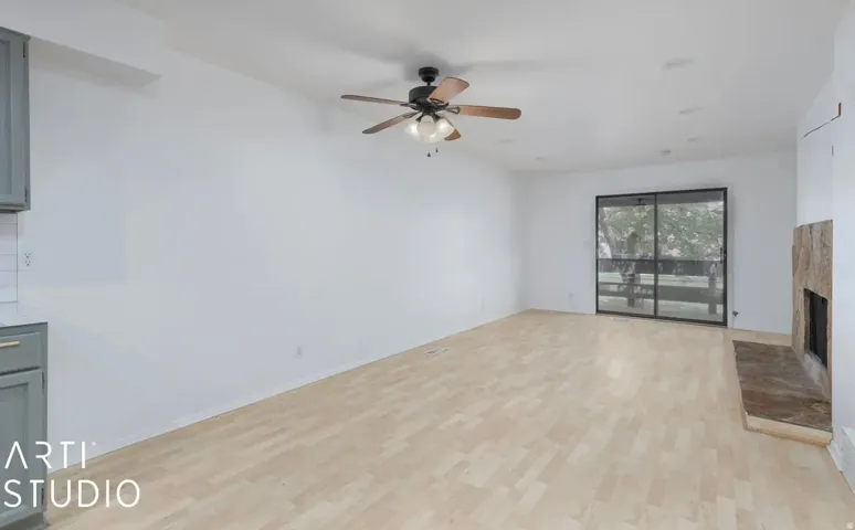 Wood-finish flooring, recessed lighting, and a ceiling fan