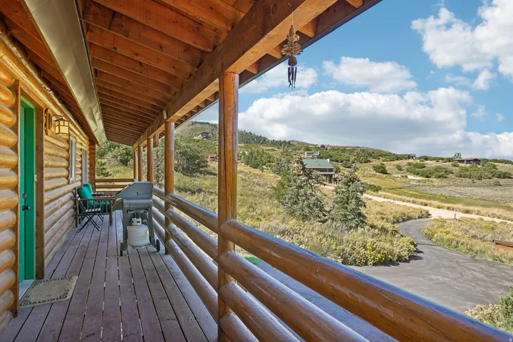Expansive wood-plank deck with log railings