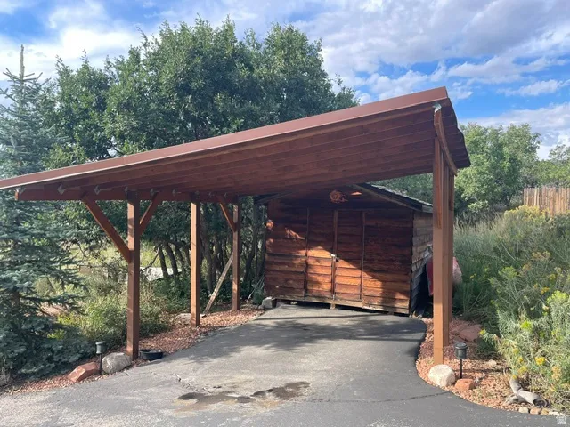 Wood-frame carport with a metal roof