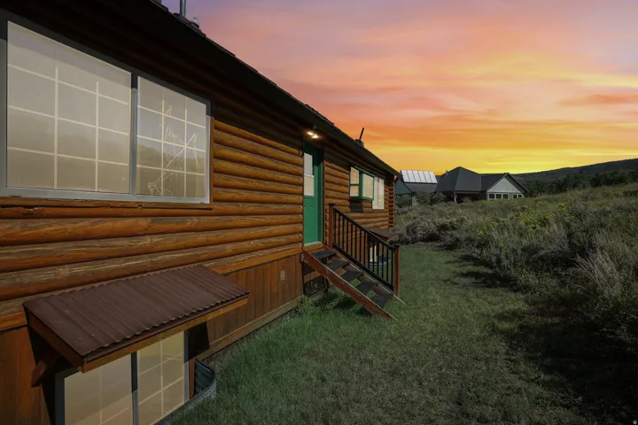 Log-style exterior siding with multiple windows