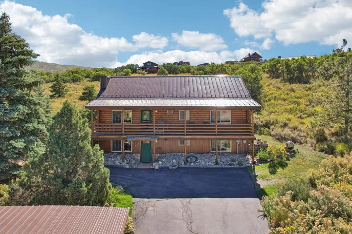 Log-sided exterior with a metal roof