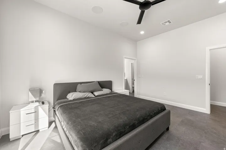 Wood-finish flooring, recessed lighting, and a ceiling fan